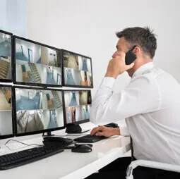 Security control room with CCTV monitoring screens at Surat Diamond Bourse